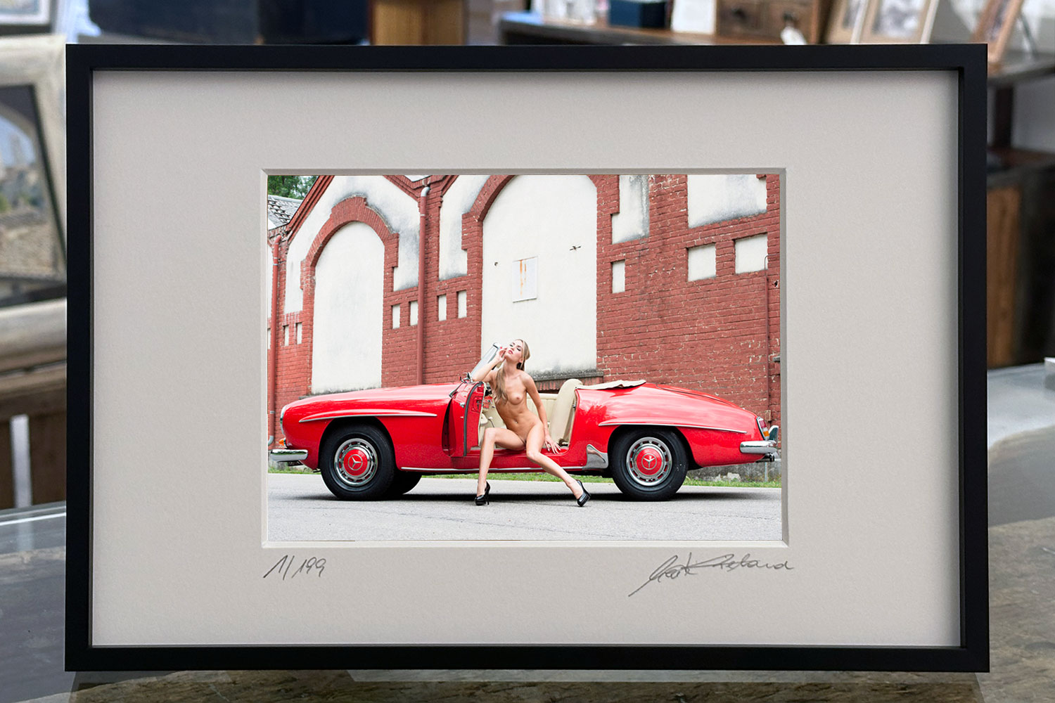 "Nitribitt’s Sunday Drive" – framed print presented on a table – limited fine art nude photography