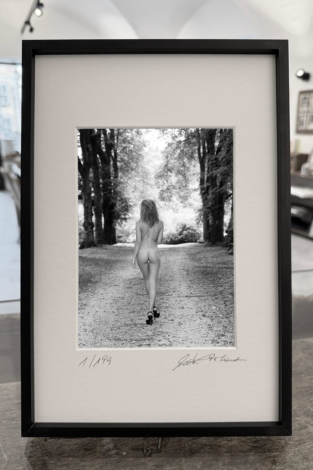 A Walk in the Park – Framed print displayed on a table – Limited-edition fine art nude photography – Mockup 3